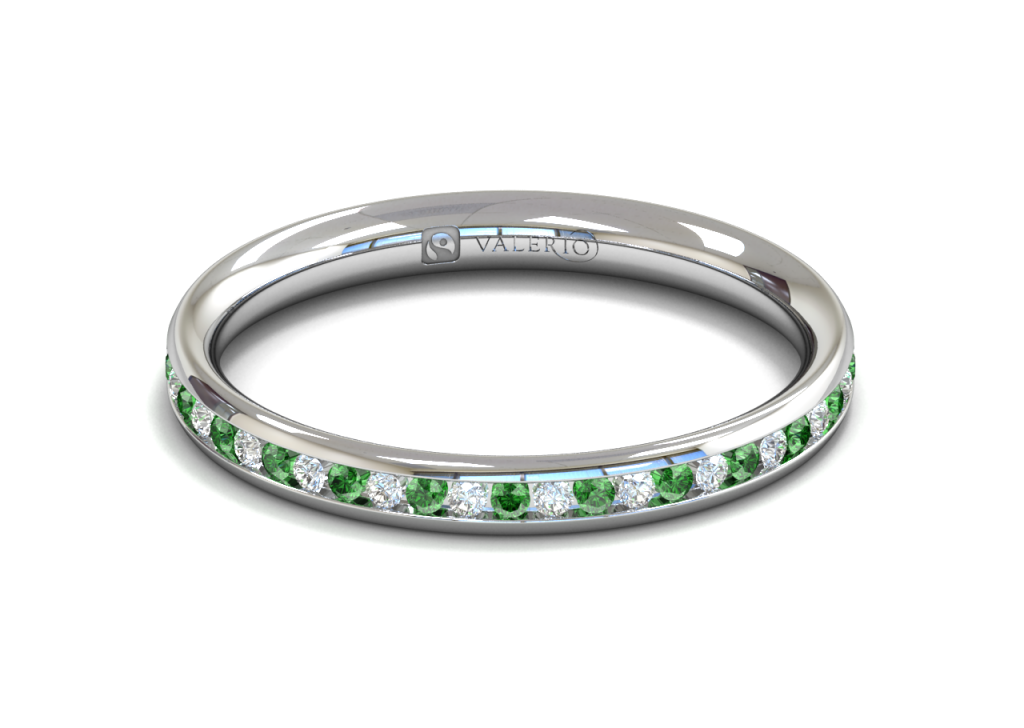 This stunning full diamond and emerald eternity ring is channel set in 18k Fairtrade Gold. Each ring holds approximately forty four 1.5mm round brilliant cut stones from our traceable suppliers. An elegant addition to your engagement ring or maybe you just love stunning colour combinations.