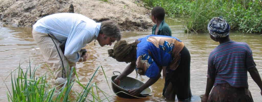 Artisanal woman mining gold in a diamond tailings pond - Sierra Leone 2005